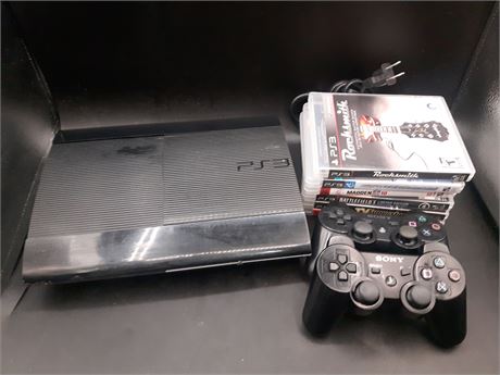 PS3 SLIM CONSOLE WITH CONTROLLERS AND GAMES - TESTED AND WORKING
