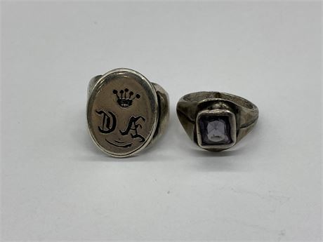 2 RINGS - ONE WITH PURPLE STONE & ONE WITH UNIQUE SYMBOLS