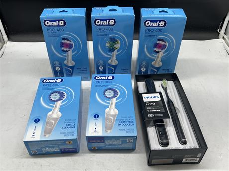 5 NEW ORAL B RECHARGEABLE TOOTHBRUSHES & NEW PHILLIPS POWER TOOTHBRUSH