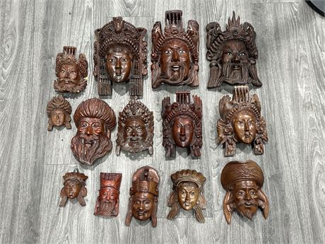 14 CHINESE CARVED WOOD MASK WALL DECORATIONS (Largest is 10” tall)