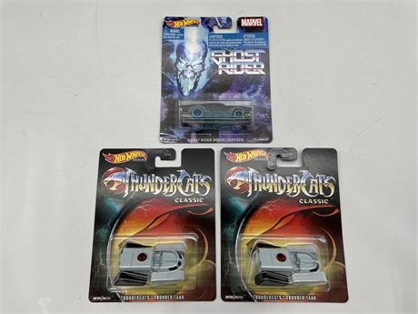 3 HOT WHEELS PREMIUM CARS (2 THUNDER-CATS TANKS & A GHOST RIDER DODGE CHARGE MIP