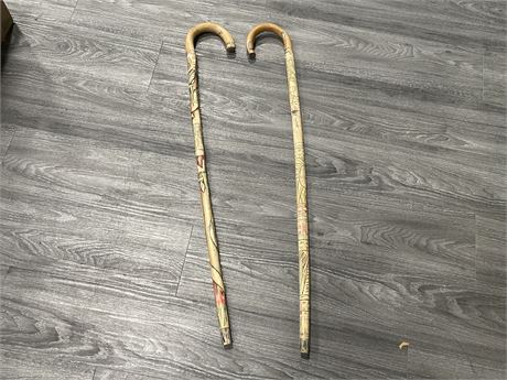 2 CARVED CANES