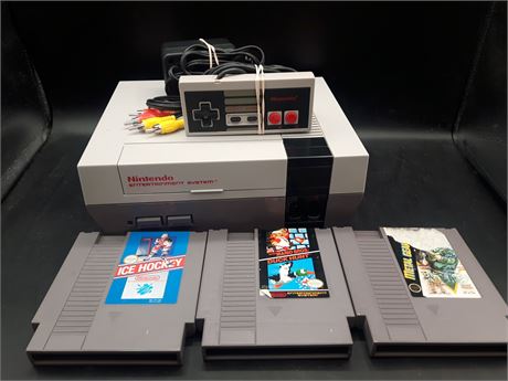 NINTENDO CONSOLE WITH GAMES