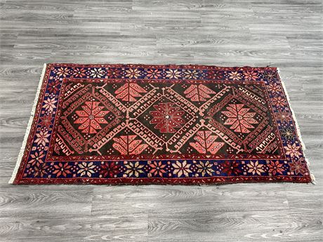 VINTAGE HANDKNOTTED WOOL RUG MADE IN IRAN (41”x75”)