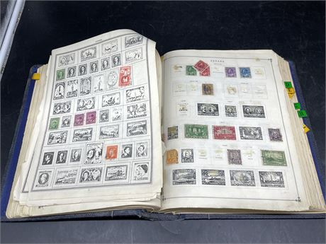 INTERNATIONAL POSTAGE STAMP ALBUM - HAS A LOT OF CANADA STAMPS