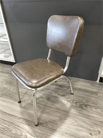 SMALL BROWN LEATHER CHAIR