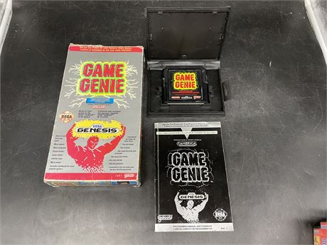 SEGA GENESIS GAME GENIE W/ ORIGINAL BOX AND GUIDE