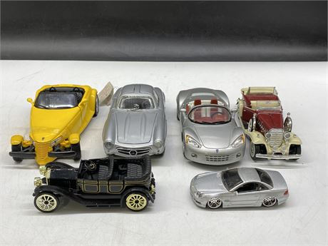 6 DIE CAST CARS (LARGEST IS 7” LONG)