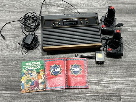 ATARI 2600 CONSOLE W/POWER SUPPLY + AB SWITCH / 2 SPECTRAVISION CONTROLLERS