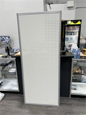 SOLID STEEL FRAMED PEG BOARD IN NEW CONDITION 32.5” x 72.5”