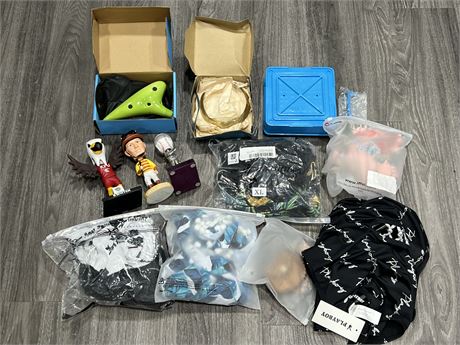 LOT OF MISC NEW PRODUCT - CLOTHES, BOBBLE HEADS, OCARINA, ETC