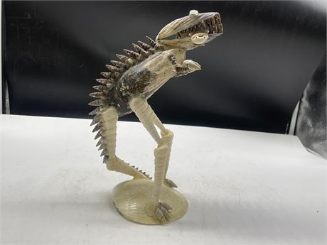VINTAGE SHELL DINOSAUR WITH SHELL MAN IN MOUTH 11”