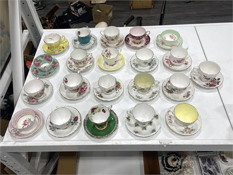 21 PAIRS OF CUPS & SAUCERS