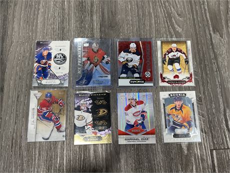 8 NUMBERED / ROOKIE CARDS