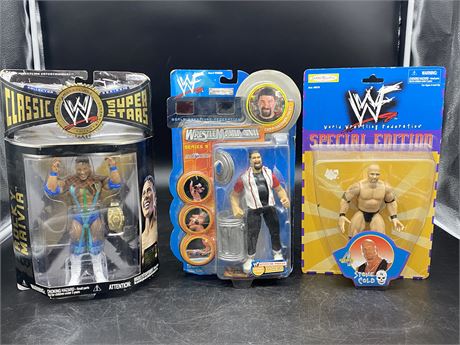 3 WWE FIGURES (Stone cold, Rocky Maivia, Commissioner Foley)
