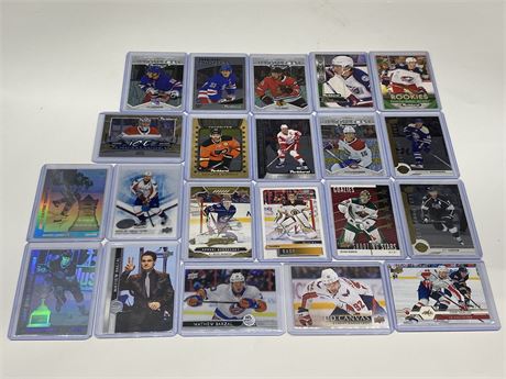 21 NHL CARDS (Includes inserts, rookies, holograms, limited editions, etc)