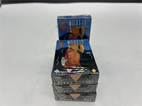 4 PACKS OF NEW/SEALED “MODELS” PLAYING CARDS