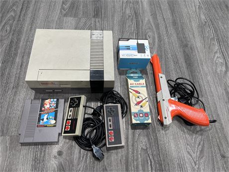 NES CONSOLE W/ NEW CORDS, GUN / GAME & CONTROLLERS - ONE CONTROLLER IS 3RD PARTY