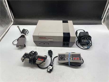 NES WITH CORDS & 2 CONTROLLERS