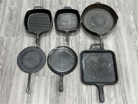 6 PIECES OF CAST IRON COOKWARE (Largest is 13” diameter)