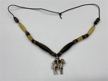 INDIGENOUS NECKLACE WITH SILVER COLOURED HORSE RIDER
