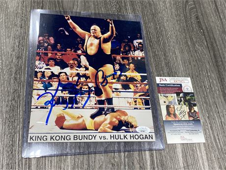 SIGNED KING KONG BUNDY PICTURE DEFEATING HULK HOGAN (W/Certificate, 9”x11”)