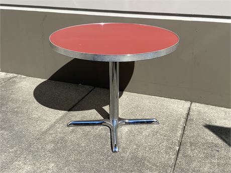 RED & CHROME BISTRO TABLE (36” wide, 29.5” tall)