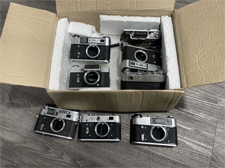 BOX OF USED CAMERAS AS IS