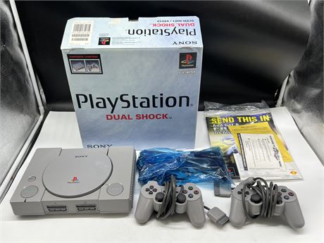 PLAYSTATION DUAL SHOCK CONSOLE COMPLETE IN BOX - BOX HAS SOME DAMAGE
