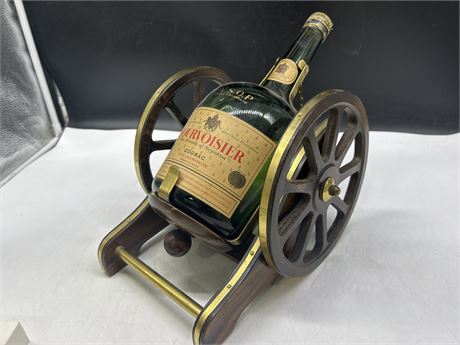 EMPTY COURVOISIER BOTTLE ON CANNON STAND