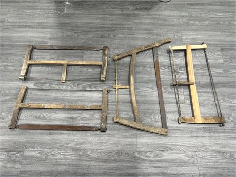 4 EARLY WOODEN SAWS - LARGEST IS 34” WIDE