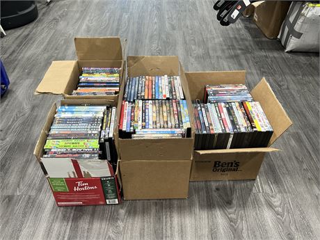 4 BOXES FULL OF DVDS