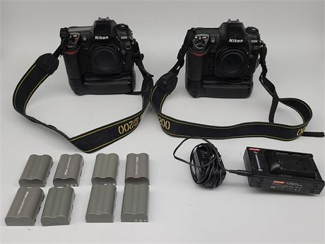 2 NIKON D200 CAMERA BODIES W/MB-200 GRIP + 8BATTERIES AND DUAL CHARGER
