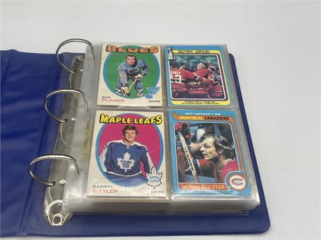 BINDER OF ASSORTED 70’s HOCKEY CARDS