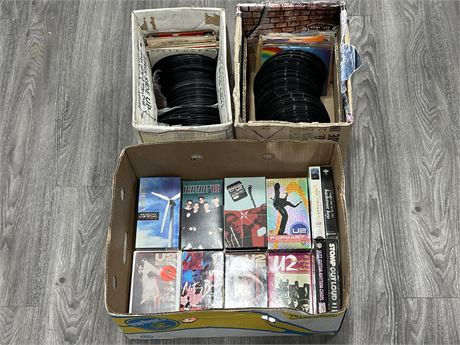 2 BOXES OF 45RPM RECORDS & BOX OF MUSIC VHS TAPES