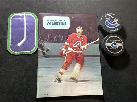 VINTAGE CANUCKS CREST / MAGAZINE / 2 PUCKS ONE OF WHICH IS A OFFICIAL GAME PUCK)
