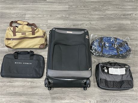 5 BAGS NEW INSIDE AIR CANADA SUITCASE ON WHEELS (18”X29”)