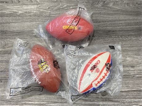 LOT OF 3 MCDONALD’S NFL FOOTBALLS IN PACKAGES