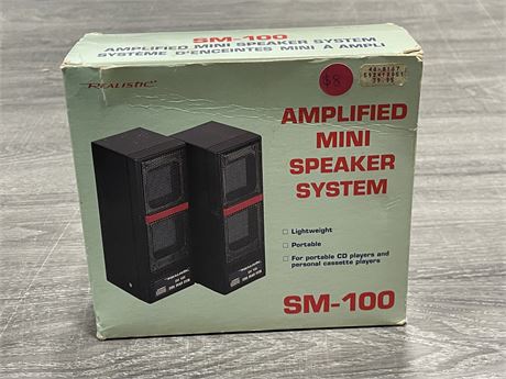 IN BOX REALISTIC SM-100 AMPLIFIED MINI SPEAKERS