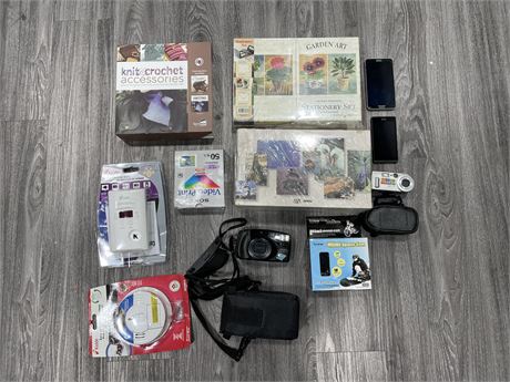 LOT OF ASSORTED GOODS (UNSURE IF PHONES OR CAMERA WORK)