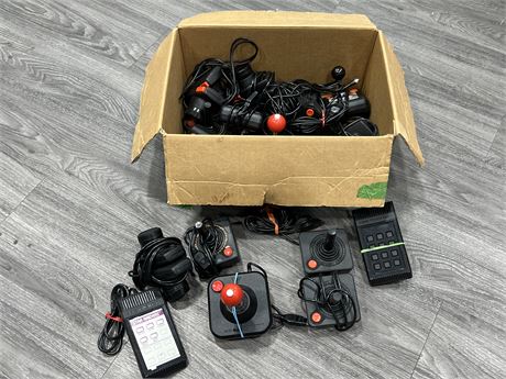 BOX OF VINTAGE VIDEO GAME CONTROLLERS, ETC