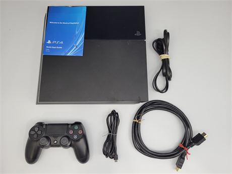 PS4 COMPLETE WITH ONE CONTROLLER AND MANUAL