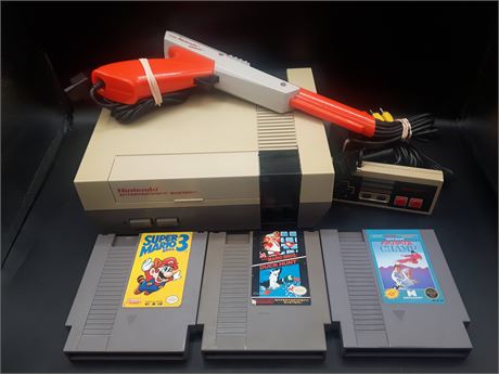 NINTENDO CONSOLE WITH GAMES