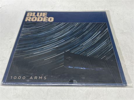 BLUE RODEO - 1000 ARMS - NEAR MINT (NM)