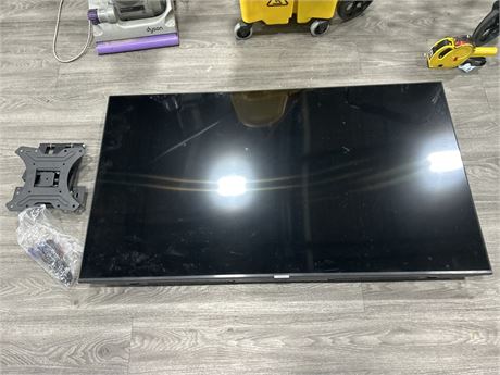 WALL MOUNTED SAMSUNG TV - 55” - NO REMOTE - POWERS ON
