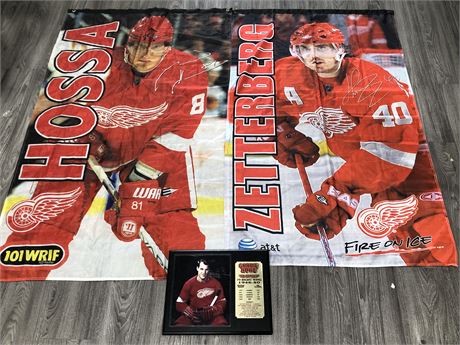 AUTHENTIC GORDIE HOWE ACHIEVEMENT PLAQUE AND 2 LARGE DETROIT RED WINGS BANNERS