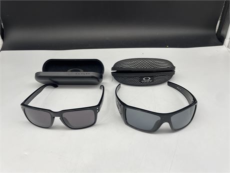 2 PAIRS OF OAKLEY SUN GLASSES W/ CASES