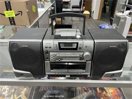PORTABLE CD / CASSETTE TAPE SOUND SYSTEM (24” wide)