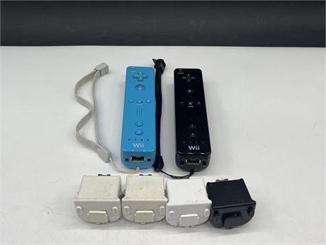 2 WII CONTROLLERS W/ 4 WII MOTION ADD ONS