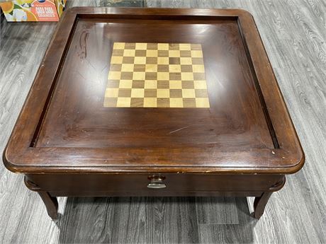 VINTAGE COFFEE/CHESS TABLE W/CUSHIONED TOP (38”x38”x22”)